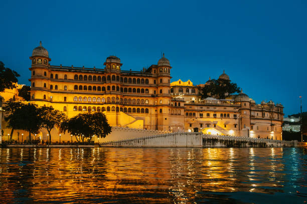 istock Illuminated City Palace By Lake In Udaipur During Evening 2197450998