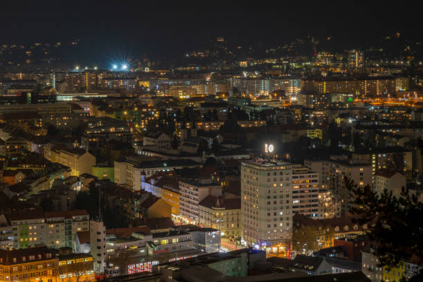 istock Night from hill with old tower in winter cold evening in Graz Austria 02 01 2025 2197453434