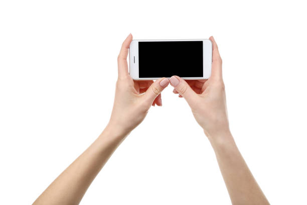 istock Smartphone in female hands isolated on white background 2197457655