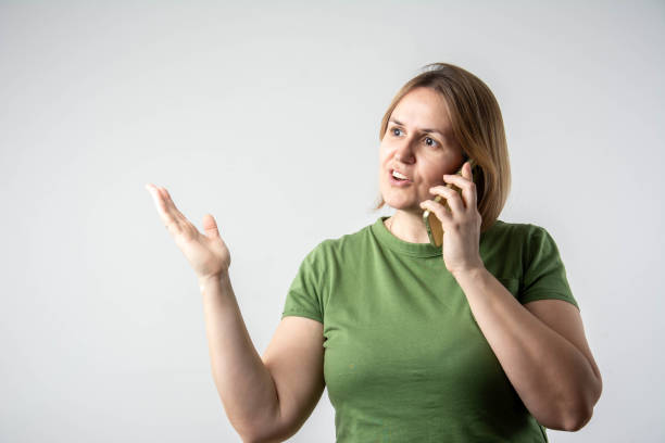Gorgeous smiling woman talking at her mobile phone.