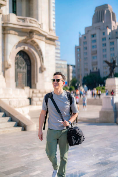 Smiling young Latino man walking in Mexico City