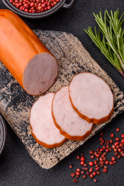 istock Delicious fresh ham cut into round slices with salt, spices and herbs 2197463580