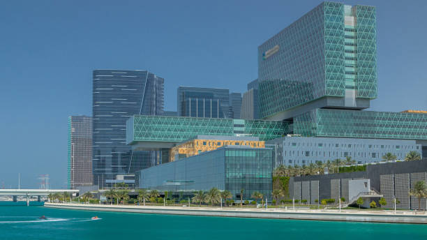 istock Modern buildings in Abu Dhabi skyline timelapse with mall and beach. 2197466121
