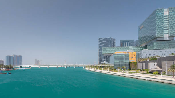istock Modern buildings in Abu Dhabi skyline timelapse hyperlapse with waterfront. 2197466195