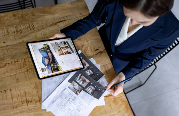 Real estate agent preparing for an open house and organizing brochures
