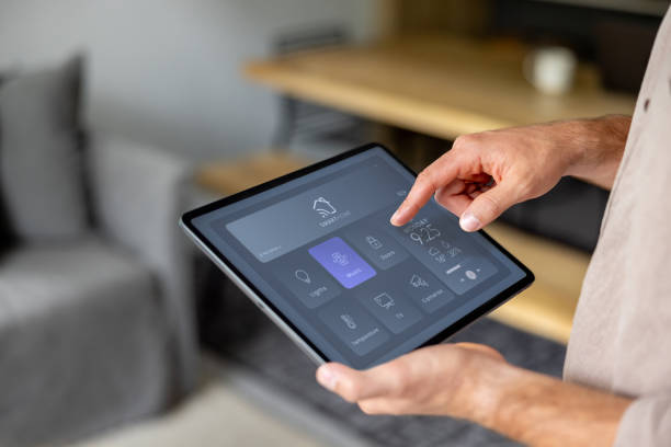 istock Man controlling the music at home using a digital tablet 2197466813