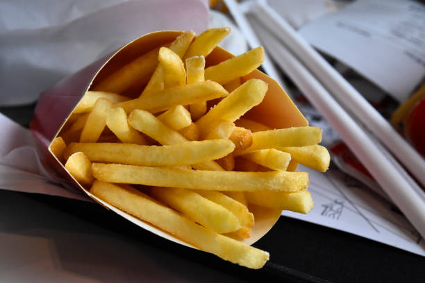 Delicious golden French fries stacked high, making them perfect as snacks, sides, or meals for everyone