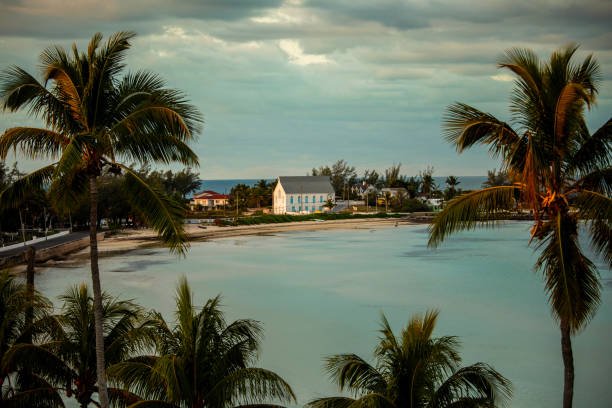A comfy home rests on a narrow strip of Carribean shoreline.
