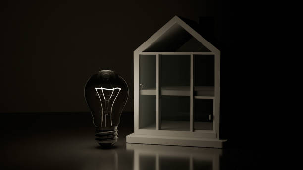 3D model of incandescent light bulb and small white house on mirror background