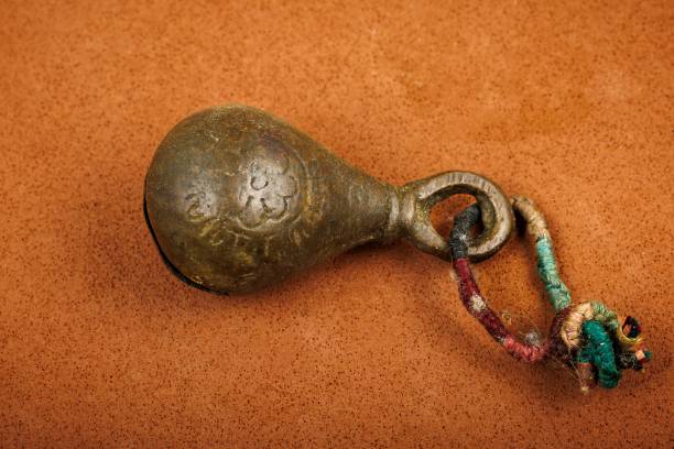 istock Ancient bronze bell with engravings and rope 2197469779