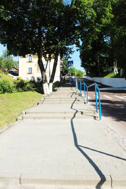 istock staircase on a sunny day between trees with railings 2197470267