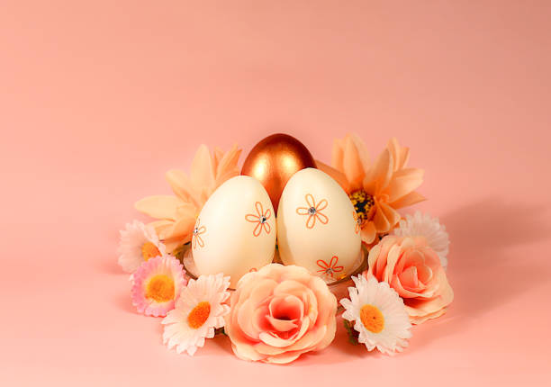 Abstract easter composition with painted eggs and spring flowers. Holiday template for design and banner for screen, minimal easter concept, selective focus.