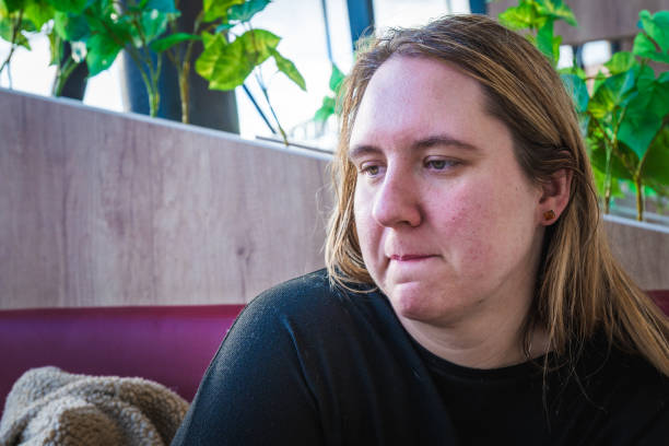 istock Contemplative moment in a vibrant cafe surrounded by lush greenery in a bustling urban setting 2197473068