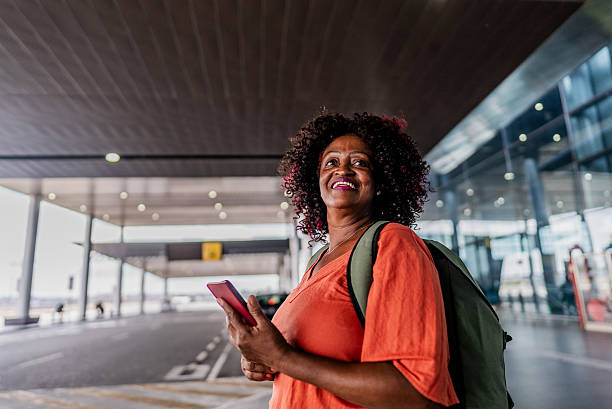 istock Senior woman looking around on a airport 2197473617