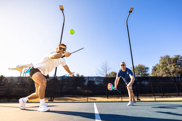 istock Hispanic friends playing pickleball 2197474544