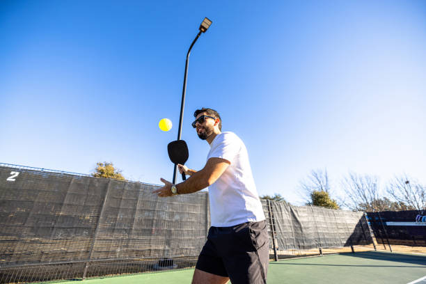 istock Hispanic friends playing pickleball 2197474660