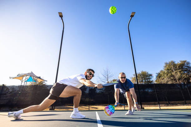 istock Hispanic friends playing pickleball 2197475155