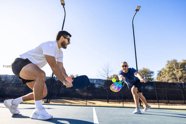 istock Hispanic friends playing pickleball 2197475222