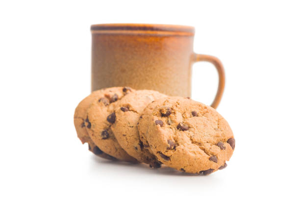 Chocolate chip cookies and mug  isolated on a white background.