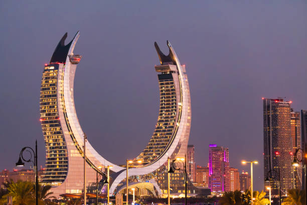 Lusail, Qatar - November 30, 2024: Katara buildings view from Lusail Marina Park. Great view with Crescent Tower