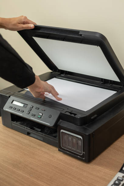 istock Woman Scanning Documents in Modern Office 2197479381
