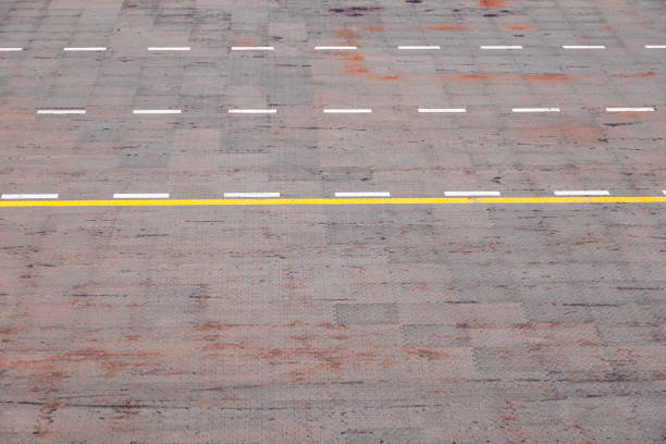 A road with paving slabs and road markings.