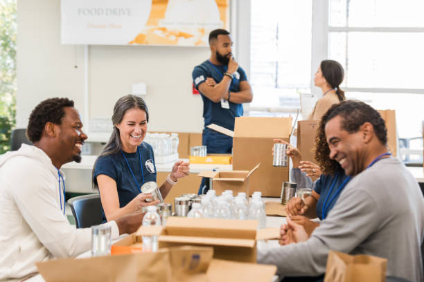 istock Volunteers Working Together at a Food Drive Event 2197479723