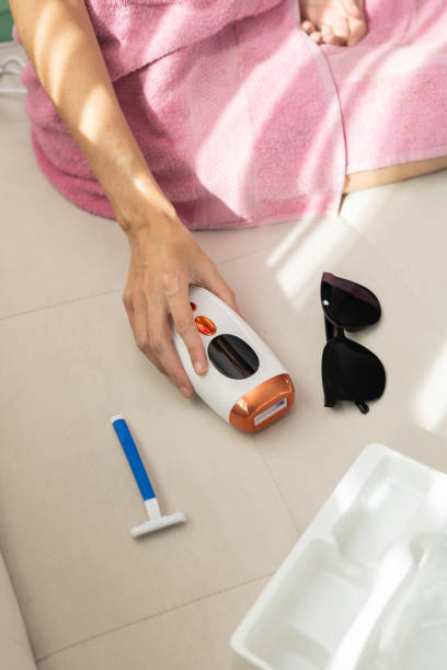 istock Shaving Razor, Shaver Machine, Sunglasses & Woman’s Hand 2197481221