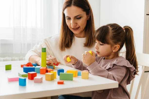 istock Mother and Daughter Enjoying Creative Playtime with Blocks 2197482133