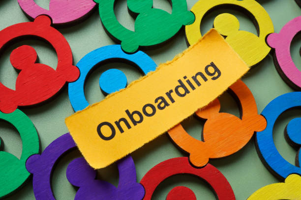 istock Multicolored employee figures and the word onboarding. Team integration. 2197482501