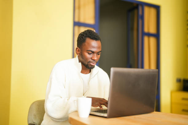 istock african american man working on laptop in office 2197483376