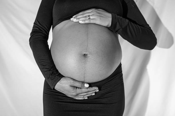 the tender belly of a pregnant woman