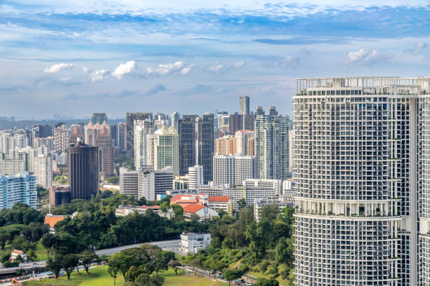 istock Modern developing residential district with tall skyscrapers and green park in the foreground, Singapore 2197489572