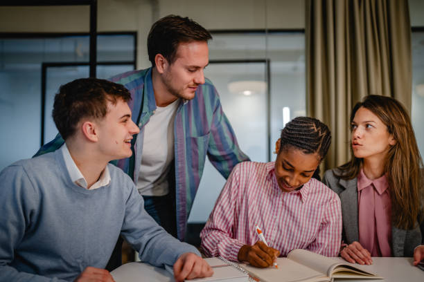 istock male director teach and help to his colleagues with new project 2197489725