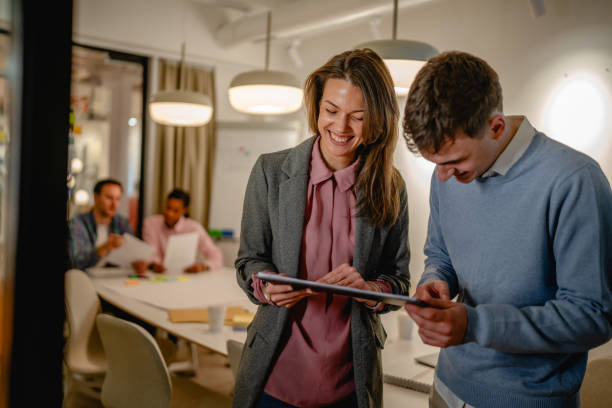 istock two colleague use together clipboard at office 2197489824