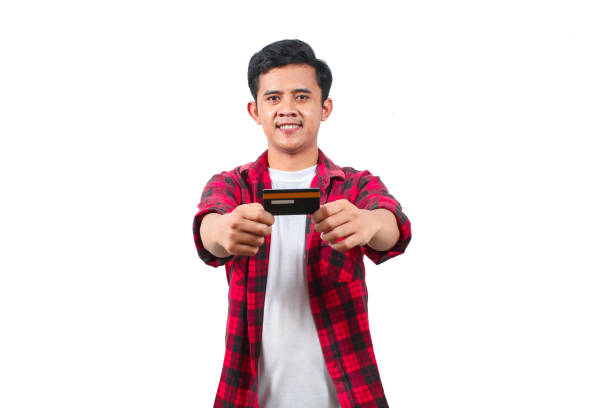 istock asian man holding credit card isolated white background 2197490162