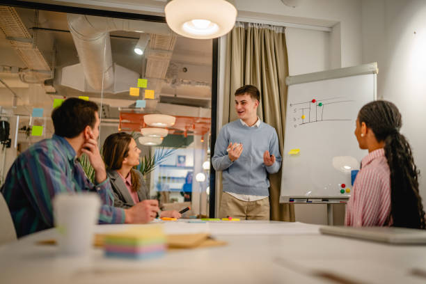 istock Caucasian businessman explain his strategy on white board 2197491662