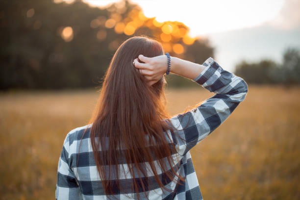 istock Young woman looking on the sunset. 2197494582