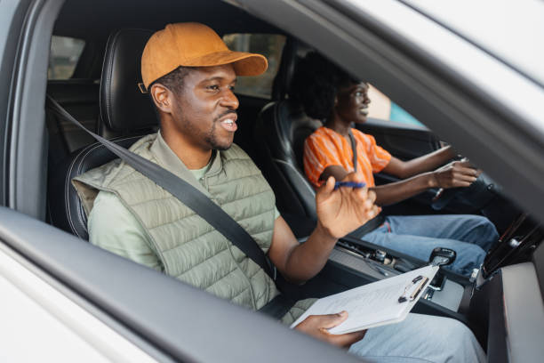 istock Man giving feedback after a woman handles the car. 2197495942