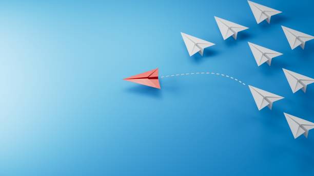 istock Different business concept.new ideas. paper art style. creative idea.red leader plane, standing out from the crowd of white planes.3D rendering on blue background. 2197503891