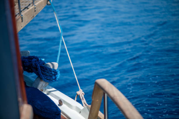 Rolled up jib of a sailing boat, Detail with paper note