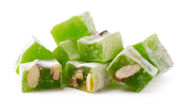 istock Colorful green Turkish delight bites with nuts displayed on a clean white surface for a sweet treat experience 2197507220