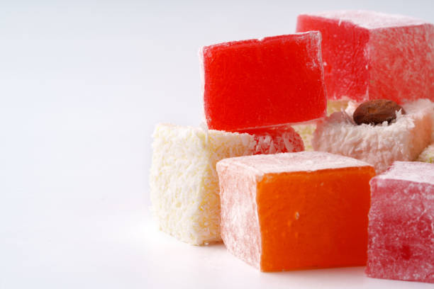 istock Colorful fruit-flavored jelly cubes arranged attractively on a plain background 2197507243