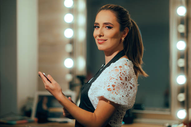 istock Happy Smiling Hairstylist or Beautician Holding a Tablet Pc 2197514088