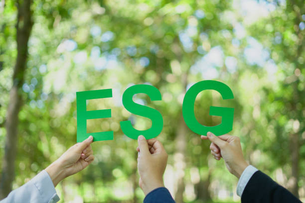 istock Hands holding ESG letters symbolize sustainability ethics governance. powerful concept promoting responsibility, environmental impact corporate social responsibility in a green world. 2197517109