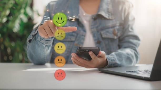 istock Customer service and Satisfaction concept, Business people touching the virtual screen on the happy Smiley face icon to give satisfaction in service. rating very impressed. 2197517383