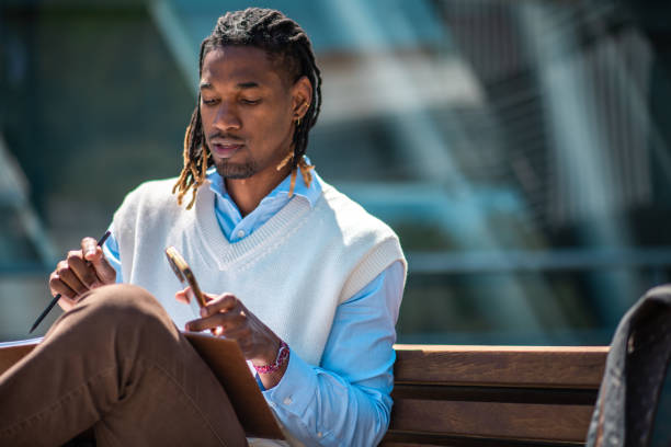 istock Focused Black Male Student Engaged in Outdoor Study 2197517919