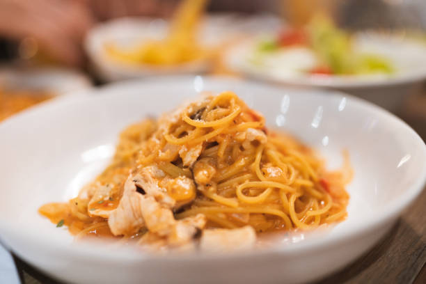 Spicy Chicken Cheese Tomato Bolognese Pasta photo for use on menus and Italian restaurant websites