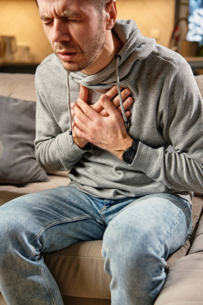 istock Man suffering from cough and chest pain 2197520226
