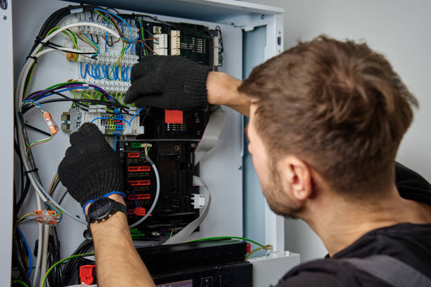 istock Electrician Repairing Heat Pump Control Panel 2197520724